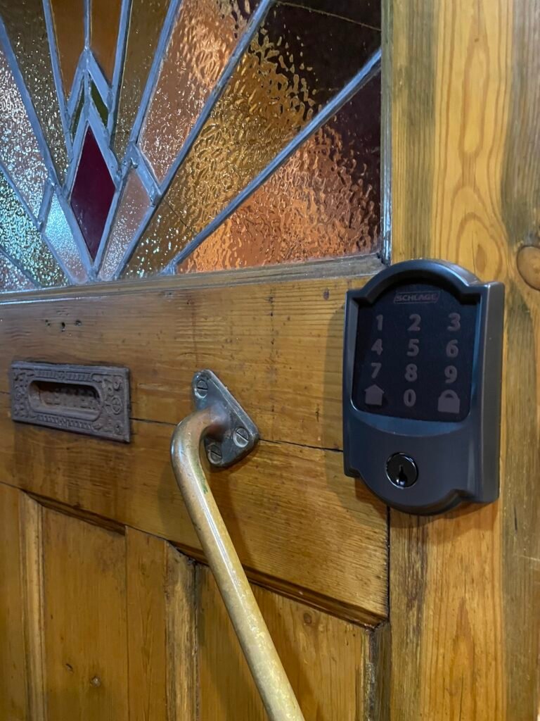 Schlage Encode keypad lock installed on a wood door on Arthur Avenue in Blue Point