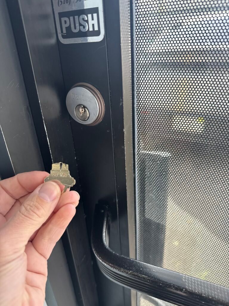 Broken key in a storefront lock on Love Lane in Mattituck before extraction