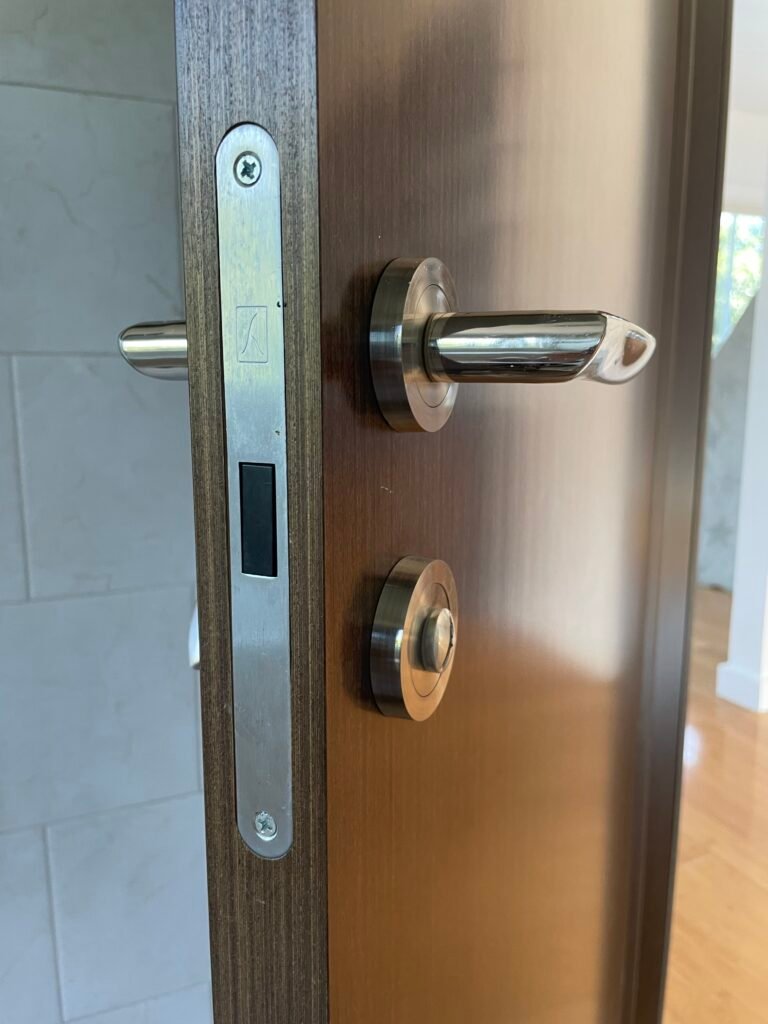 Italian-brand magnetic mortise lock and polished lever installed on a wood door on Teapot Lane in Smithtown